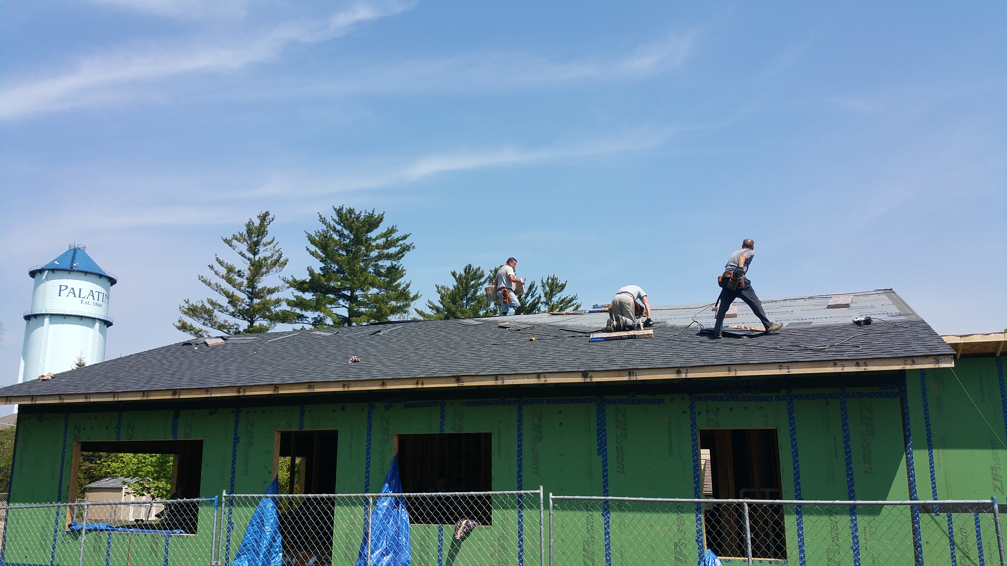 roofers shingling south side