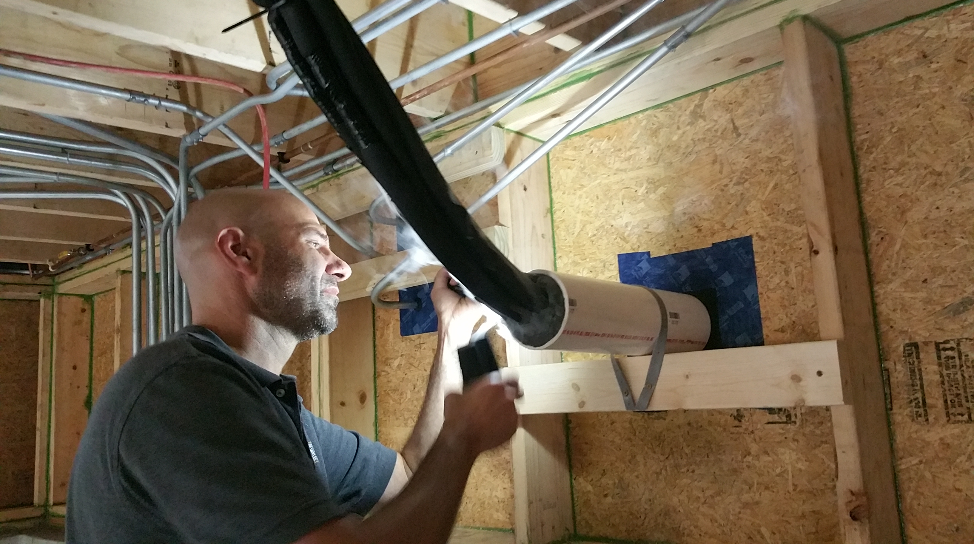Steve testing for air leaks @ pvc:refrigerant lines